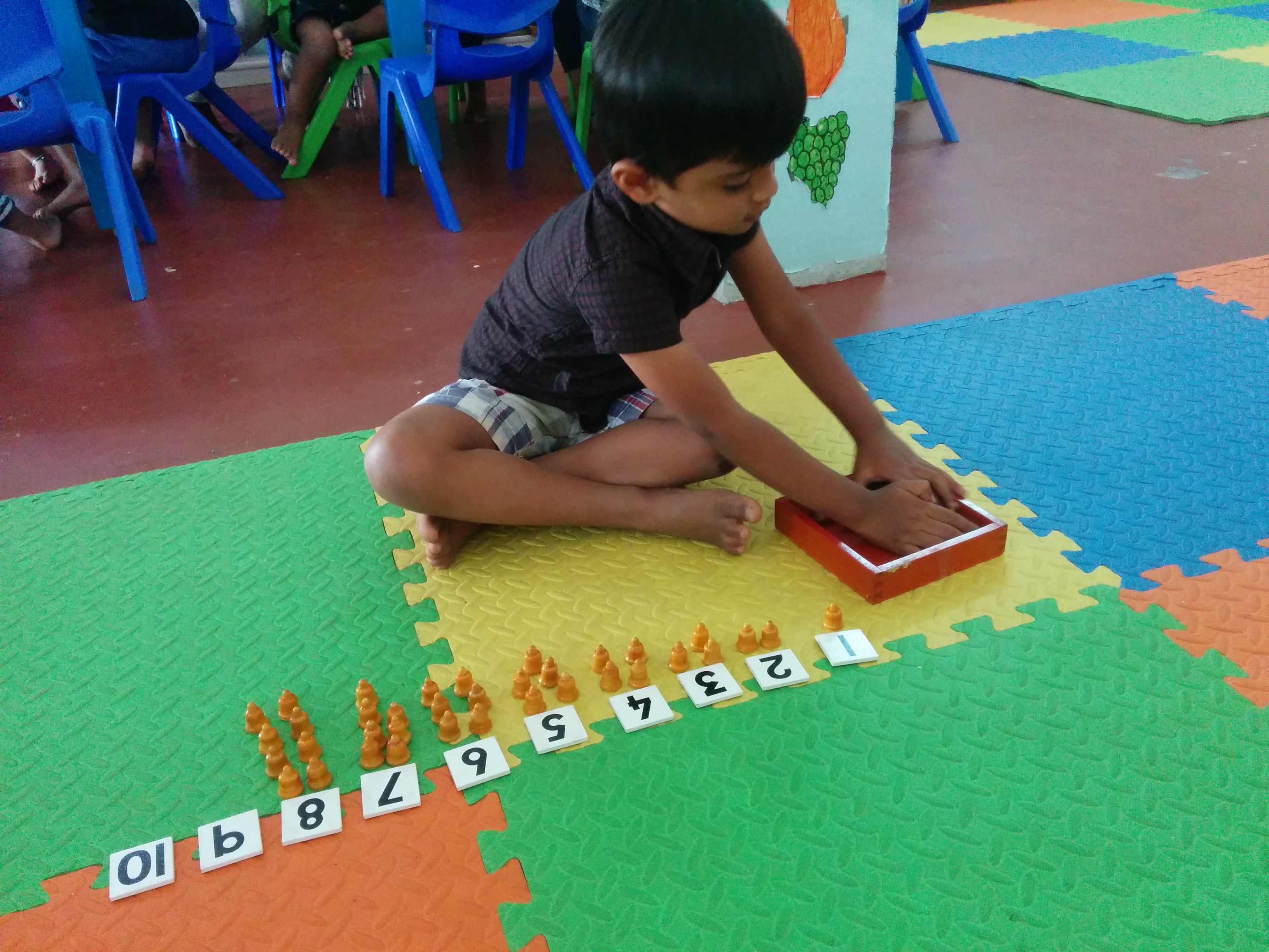 Child Working with Cards and Counters
