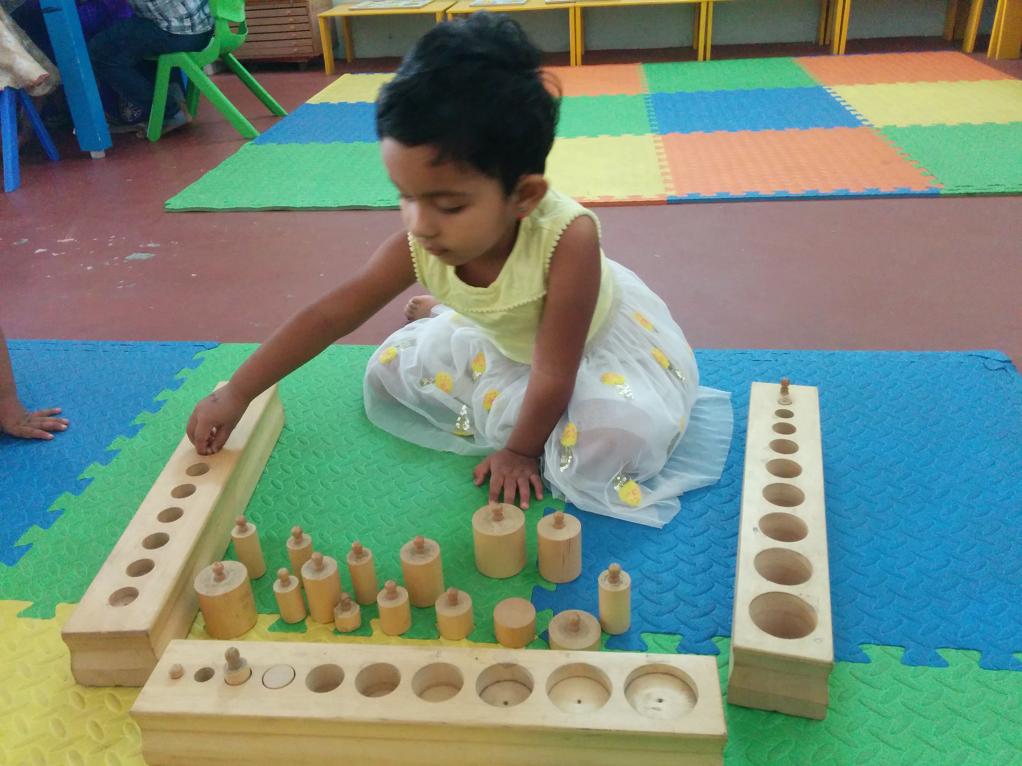 Child Working with Cylinder blocks