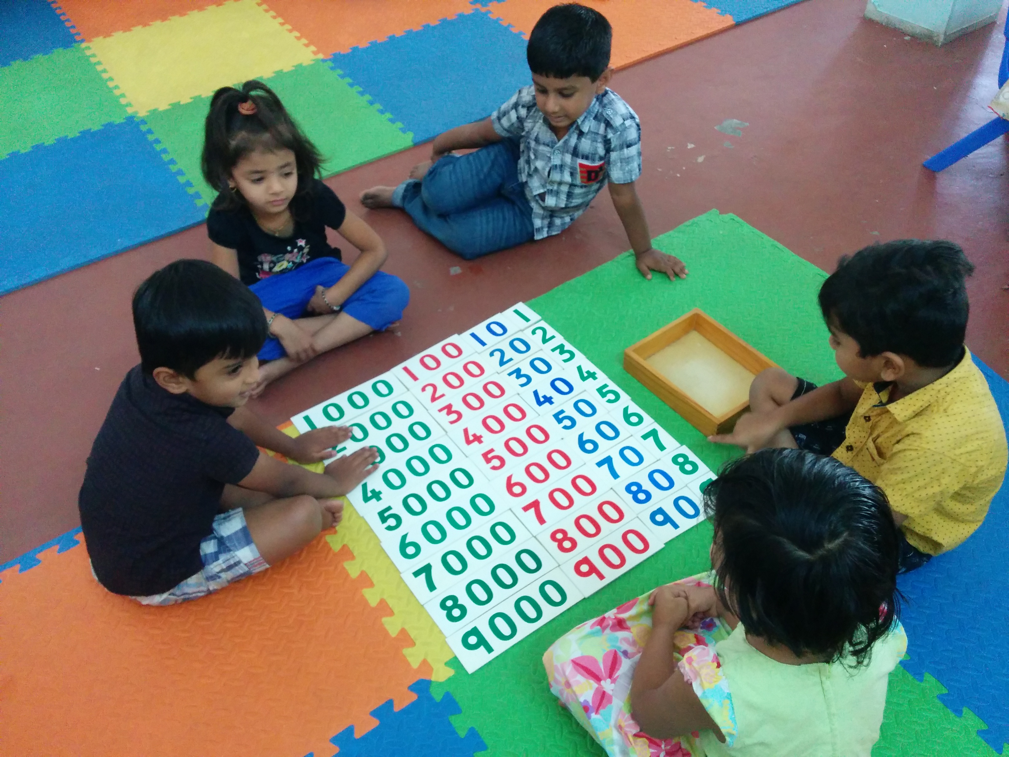 Child Working with Decimal cards