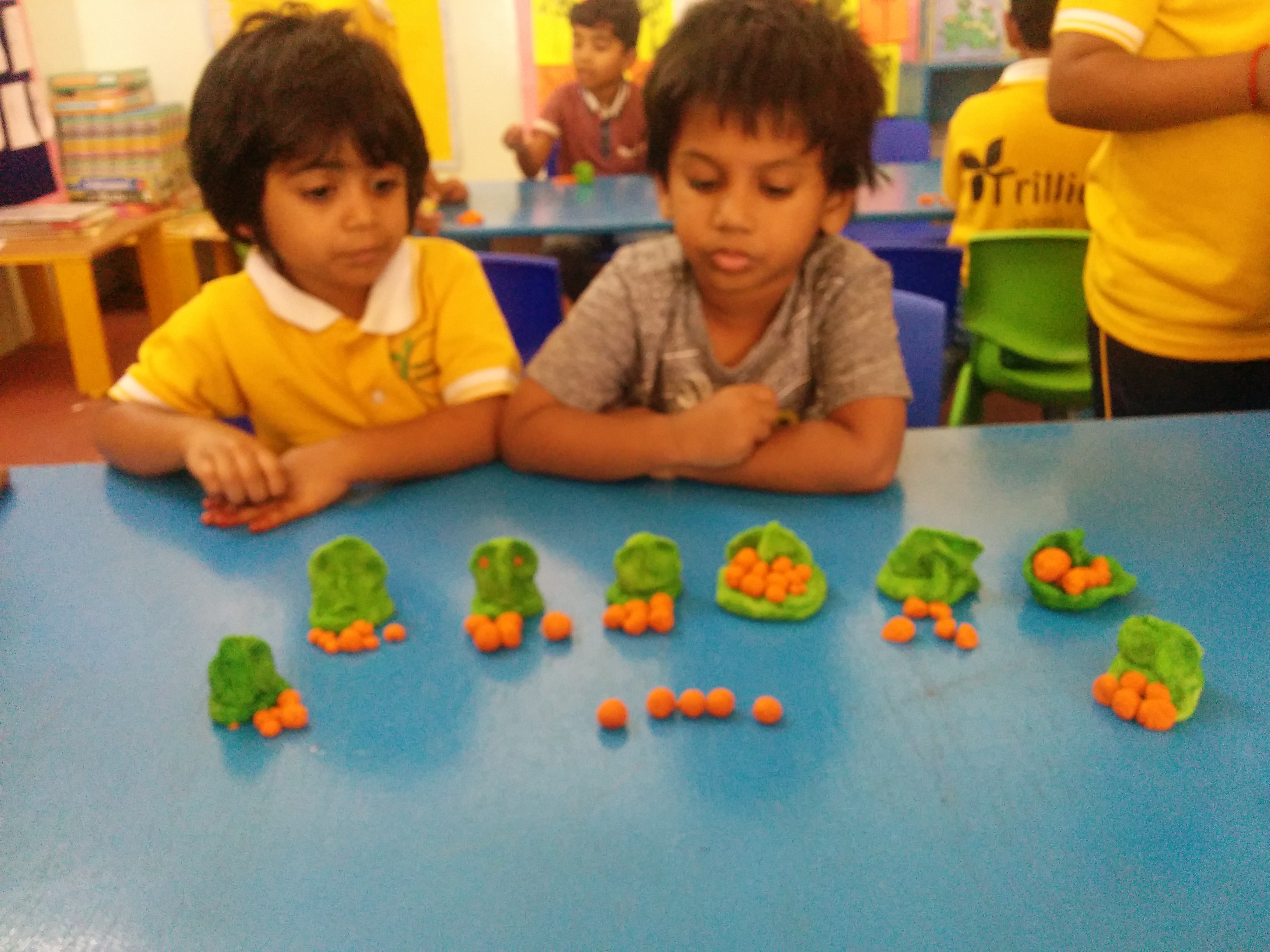 Child Making Ganesha and Ladoo