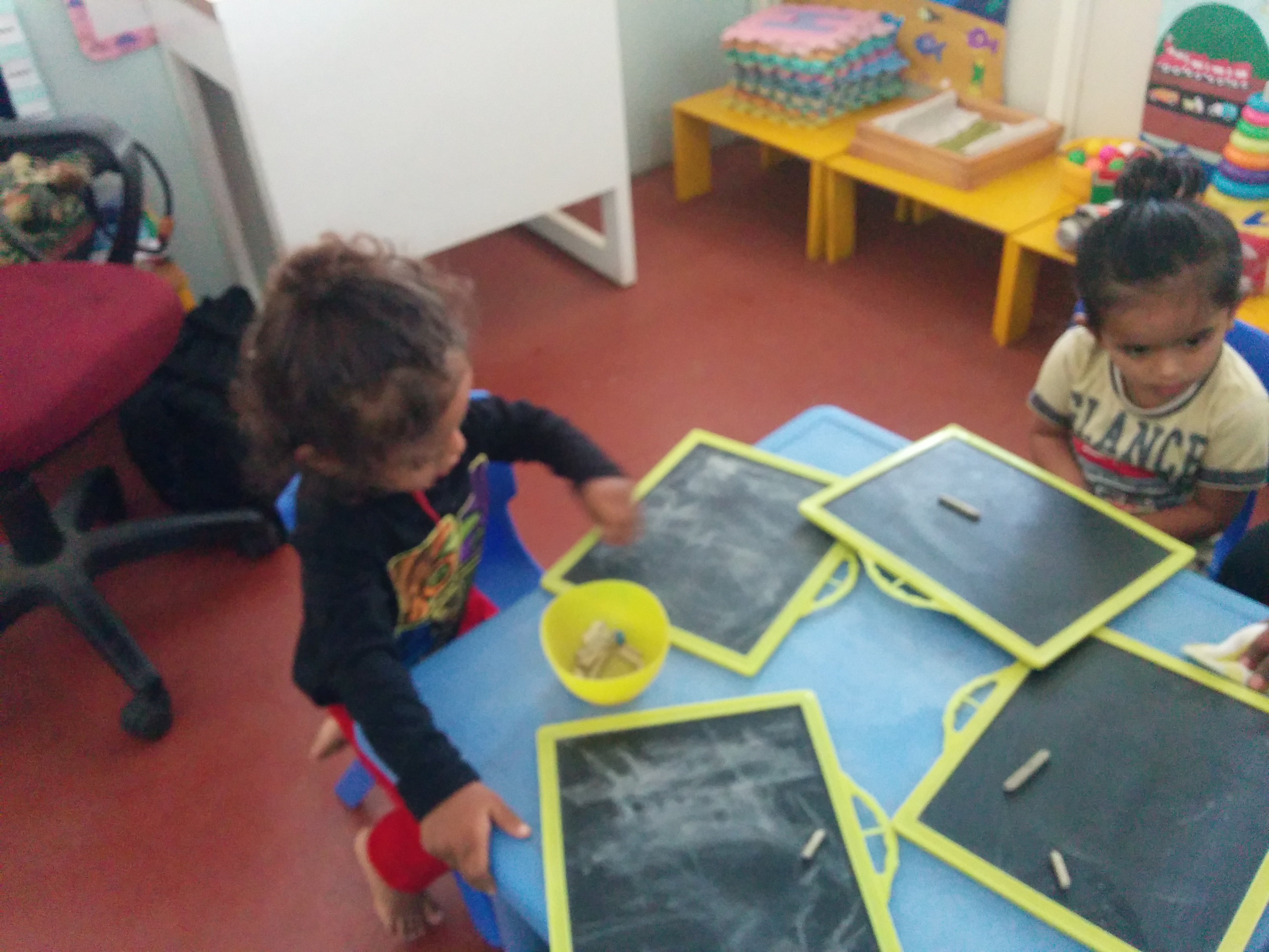 Child drawing on slate